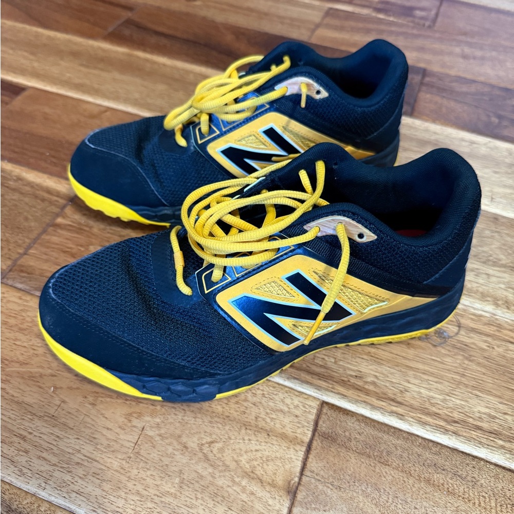 New Balance Black and Yellow Turf shoes